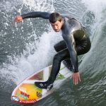 Surfer_at_the_Cayucos_Pier,_Cayucos,_CA